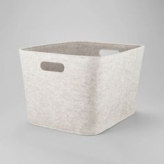 a white storage basket on a grey background