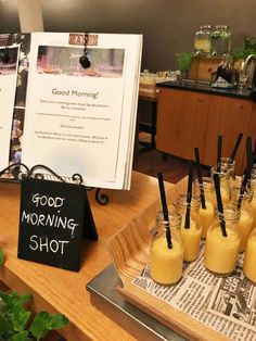 there are many drinks on the table with good morning shot signs in front of them