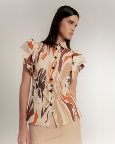 Immerse yourself in the wild essence of the Savannah with our Straight Shirt with Puffed Sleeves and Safari Print. This garment merges the authenticity of ethnic fabrics with a palette of earth and terracotta tones, enhanced with touches of lime orange. The puffed sleeves achieve a perfect balance between the wild and the sophisticated. Lapel collar and short sleeve shirt with ruching. Interior yoke detail on the sleeve to add volume. Front button closure. Side slits. Abstract safari print in ca Safari Print, Shirt Blouses Women's, Puffed Sleeves, In The Wild, Independent Designers Fashion, Lapel Collar, Coat Dress, Badger, The Wild