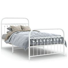 a white metal bed frame with pillows and blankets on it's headboard, in front of a white background