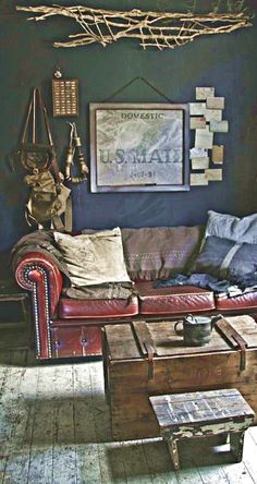 a living room filled with furniture and pictures on the wall above it's coffee table