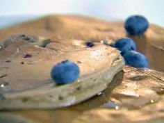 pancakes with blueberries are on a plate