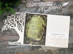 a wedding card with an image of a tree on it