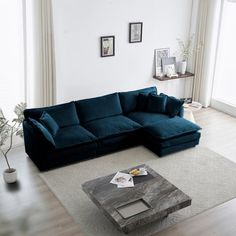 a living room with a large blue sectional couch