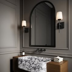 The Blake Vanity Collection references a classic silhouette paired with a modern, sleek finish in distinctive matte black. Versatile and stylish, this transitional wall sconce makes a wonderful addition to your primary bathroom vanity and adds sophistication to your powder room. Featuring a slim arm mounted to a square backplate, supporting a beautiful frosted glass shade, this 16” tall wall light provides soft illumination for your room. The Blake is also available in a coordinating 24" 3 light Powder Room Sconces Bathroom Lighting, Bathrooms With Sconces, Black Sconces Bathroom, Primary Bathroom Vanity, Black Bathroom Sconces, Powder Room Sconces, White Traditional Bathrooms, Bathroom Light Sconces, Bathroom Mirror Light