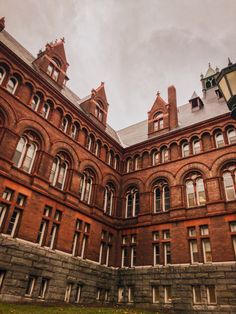 an old red brick building with many windows