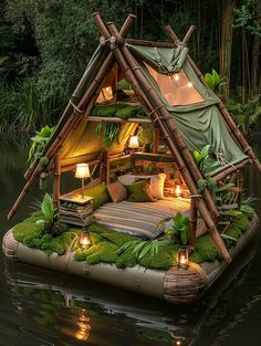 a floating bed made out of bamboo sticks with lights on the roof and moss growing inside