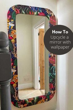 an upcycle mirror with wallpaper on it