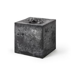 a black square candle holder on a white background