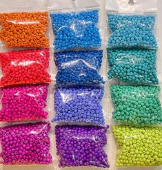 there are many different colors of beads in the bag