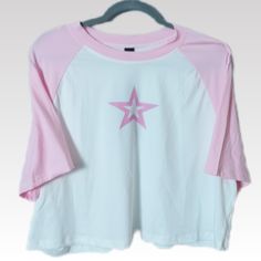 This Pink And White Graphic T-Shirt In Womens Plus Size 4xl Is New With Tags! This Cropped Crew Neck Short Sleeve Top Features A Front Graphic Logo Displaying A Pink Hollowed Out Star. A Great Addition To Your On The Go T-Shirt Collection. Features A Baseball Style Cut With Short Raglan Sleeves. Top Is Made Of A Stretch Knit And Oversized For Added Comfort... *Measurements & Details: Bust/Chest (Ptp): 25" Length: 19" Color: Pink/White Material: 95% Polyester / 5% Spandex *Measurements Are Approx Cheap Heart Print Relaxed Fit T-shirt, Crew Neck Tops With Star Logo For Summer, Graphic Tees Cute, Casual Summer Tops With Star Logo, Casual Summer T-shirt With Star Logo, Casual Tops With Star Logo And Relaxed Fit, Relaxed Fit Short Sleeve Tops With Star Logo, Casual Relaxed Fit Tops With Star Print, White Star Print T-shirt For Spring