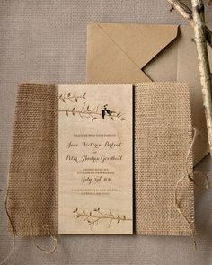 the wedding stationery is made from burluck paper and has a bird on it