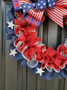 a patriotic wreath with red, white and blue mesh