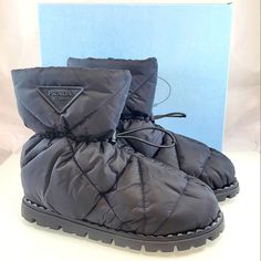 Nwt$1,120 Prada Blow 19 Quilted Nylon Drawstring Winter Snow Bootie Boot Sz 39.5 Prada's Blow 19 Puff-Quilted Boots Are Crafted Of Nylon And Complete With A Drawstring Closure. Recycled Polyamide Upper Round Toe Pull On With Drawstring Recycled Polyamide Lining Rubber Sole Made In Italy Size Heel Height, About 0.75" (19mm) Shaft Height About 9.5" Brand New From Saks Fifth Avenue!! Strikeout To Prevent Returns Back To Saks. 100% Authentic With Original Box!! Tags: Fall, Autumn, Halloween, Winter, Nylon Boots With Round Toe For Fall, Black Nylon Boots With Padded Ankle, Fall Nylon Boots With Round Toe, Winter Nylon Boots With Round Toe, Luxury Winter Boots For Outdoor, Luxury Winter Outdoor Boots, Designer Winter Boots With Lug Sole, Designer High-top Winter Boots, Designer Waterproof Boots With Round Toe