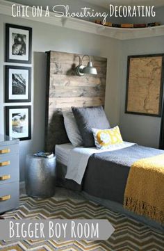 a bed room with a neatly made bed and pictures on the wall above it that says, chic on a shading decorating bigger boy room