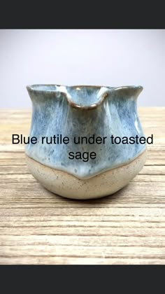 a blue ruttle under toasted sage bowl on a wooden table with the words blue ruttle under toasted sage below it