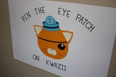 a sign that says pin the eye patch on kiwazii with an image of a cat wearing a hat