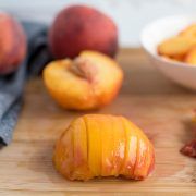 peaches and other fruits on a cutting board