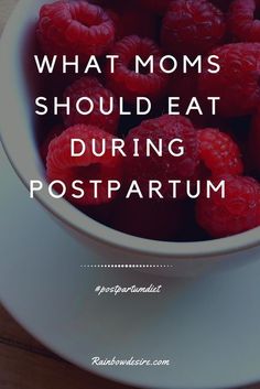 a bowl full of raspberries with the words what moms should eat during postpartum