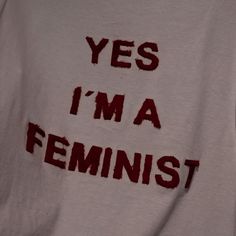 the words yes i'm a feminist written on a white t - shirt