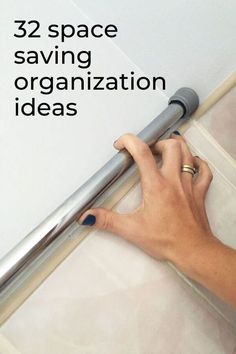 a person is writing on a piece of paper with the words, 32 space saving organization ideas