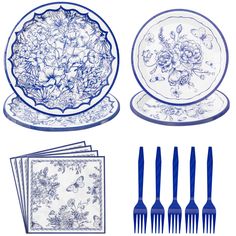 blue and white dinnerware with floral designs on the plates, napkins and forks