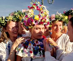 a group of women with flower crowns on their heads