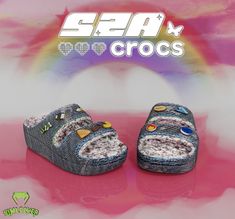 a pair of blue shoes sitting on top of a pink and white background with the word sea crocs