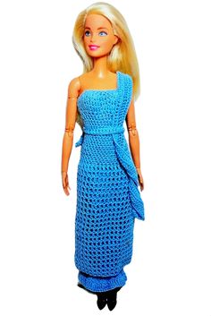 a barbie doll wearing a blue crocheted dress