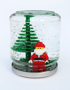 a glass jar with a christmas tree in it