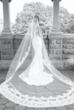 a woman in a wedding dress and veil