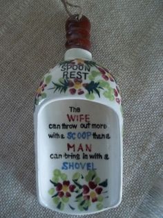 a ceramic bottle with a poem on it