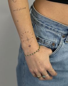 a woman with a tattoo on her left arm and the word love written in cursive writing