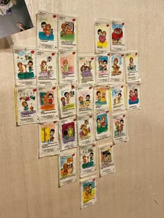 a bunch of cards are hanging on the wall