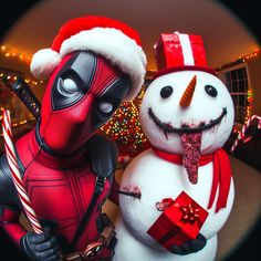 two snowmen dressed as deadpools are posed in front of a christmas tree