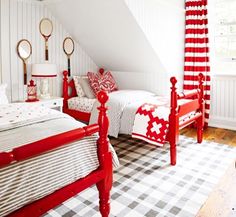 a bedroom with two beds and a checkered floor