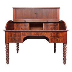 an antique wooden desk with drawers and turned over legs, on white background in full view