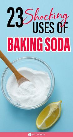 baking soda in a glass bowl with a wooden spoon and lemon wedges on the side