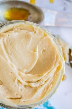 a jar filled with peanut butter sitting on top of a table