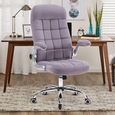 a purple office chair sitting on top of a rug