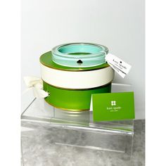 a green and white container with a tag on it