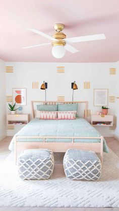 a bedroom with pink walls and white carpet