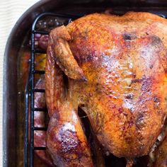 a whole chicken sitting on top of a grill