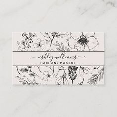 a business card with flowers on it