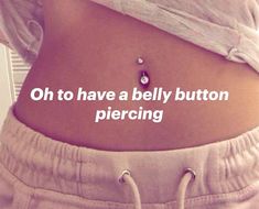 a woman's stomach with the words oh to have a belly button piercing