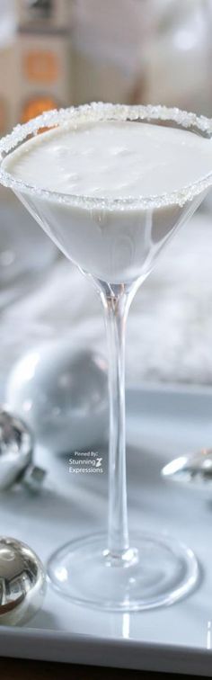 a martini sitting on top of a silver tray