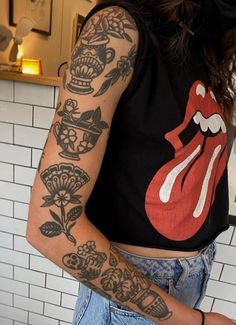 a woman with a tattoo on her arm