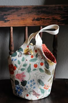 a purse sitting on top of a wooden chair