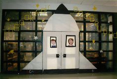 an image of a rocket ship made out of paper and cutout people in the window