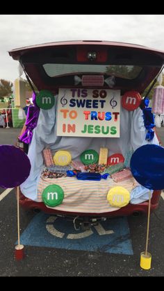 the trunk of a car is decorated with candy and candies